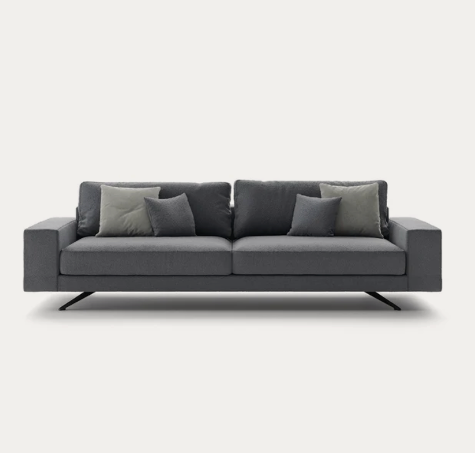 Modern dark grey sofa with black metal legs and scatter cushions